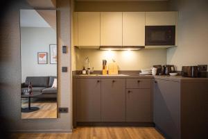 a kitchen with a counter and a living room at stuub karlsruhe in Karlsruhe
