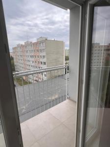 a balcony with a view of a building at Entrez SNP - pri fakultnej nemocnici in Košice