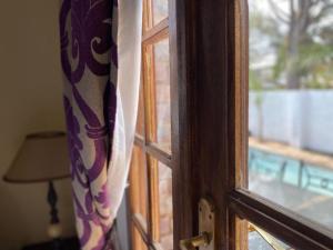 a close up of a window with a curtain at La Mia casa in Gaborone