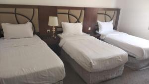 Postel nebo postele na pokoji v ubytování New Hira Jeedah