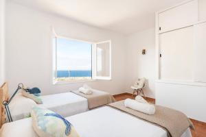 En eller flere senge i et værelse på Villa Antonita by Villa Plus + 17 billeder