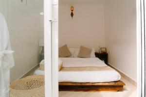 Giường trong phòng chung tại The Prime Escape Town House +154 ảnh