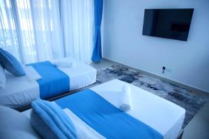 Ένα ή περισσότερα κρεβάτια σε δωμάτιο στο Maskani Bliss +2 φωτογραφίες