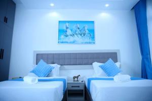 Ένα ή περισσότερα κρεβάτια σε δωμάτιο στο Maskani Bliss