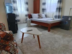a living room with a couch and a coffee table at block G in Mombasa