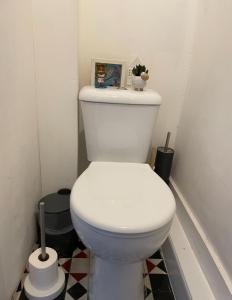 a bathroom with a white toilet in a room at Entire Peaceful in Central London in London +3 photos