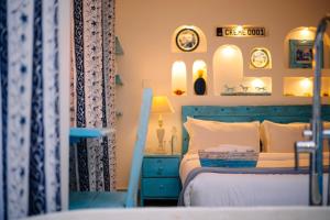 a bedroom with a blue bed and a blue dresser at Studio Bleu by The Prime Escape in Arusha