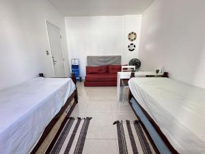 Postel nebo postele na pokoji v ubytování Apto na Tupi - 5 min da Praia!