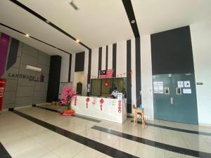 a lobby of a building with a counter in the middle at Landmark Residence 1 And 2 - Kajang in Kajang