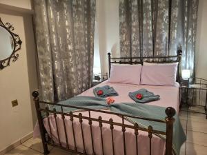 a bedroom with a bed with two towels on it at Aegean escape in Mytilini in Mytilene