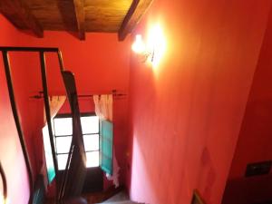 a room with a light on the wall and a window at Carpe Diem in Navaridas