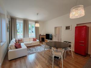 a living room with a couch and a table at Villa Miami Taormina in Taormina