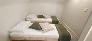 two twin beds in a room with at b&b Castrum in Terlizzi +3 photos