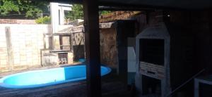 a blue tub in a room with a window at Cop 30 in Belém