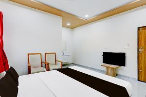Postel nebo postele na pokoji v ubytování Hotel O RamdevGarh Resort + 22 fotografií