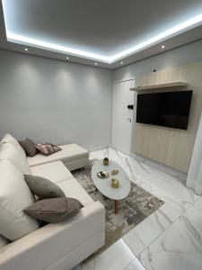 TV a/nebo společenská místnost v ubytování Apto 201 bloco 02 · Apto Moderno em frente à Arena MRV / Expominas