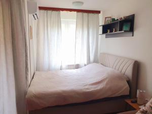 Postel nebo postele na pokoji v ubytování Apartman n&v
