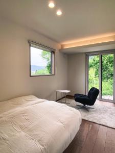 Postel nebo postele na pokoji v ubytování Kaflihaus - Secluded Goryu Villa