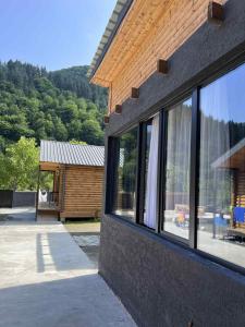 a building with windows on the side of it at Khando's Resort in Passanauri