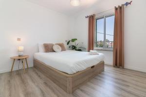 Postel nebo postele na pokoji v ubytování Casa Azeitao