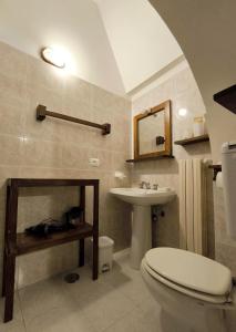 a bathroom with a toilet and a sink at Da Nonna Filomena in Alberobello