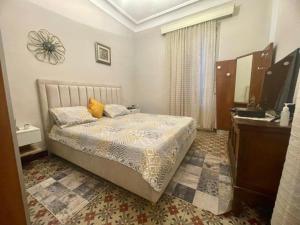 Una cama o camas en una habitación de Alger-Centre - Dar Mima - Vue sur mer