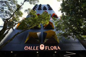 a building with a sign that reads calle flora at Calle Flora Hotel by Jalo in Medellín