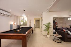a living room with a pool table in it at Luxury stay at a great price 88 by Spacey #71 in Cairo