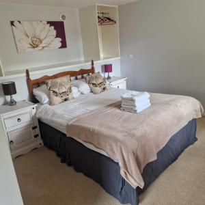 Ένα ή περισσότερα κρεβάτια σε δωμάτιο στο Black Isle Holiday Apartments Avoch