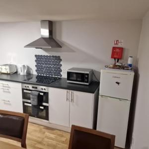 Η κουζίνα ή μικρή κουζίνα στο Black Isle Holiday Apartments Avoch +30 φωτογραφίες