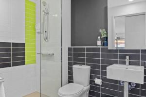a bathroom with a toilet and a sink at Serrata - 2B2B Docklands Apt Parking Available in Melbourne +35 photos