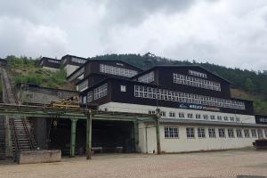 a large black building on top of a mountain at Hexnquartier in Braunlage