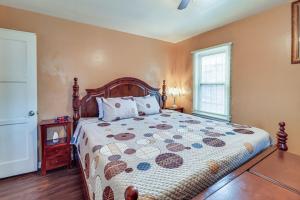 a bedroom with a large bed and a window at Detroit Retreat with Gazebo Fire Pits and Charcoal Grill in Detroit