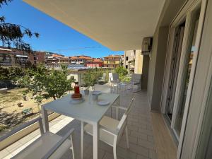 a white table and chairs on a balcony at Dimora House and Relax in San Benedetto del Tronto