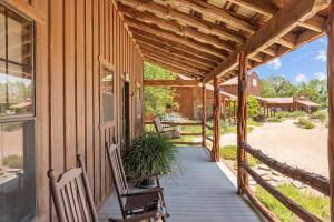 a porch of a house with chairs and a plant at SisterCreek Ranch - Other Cabin in Boerne