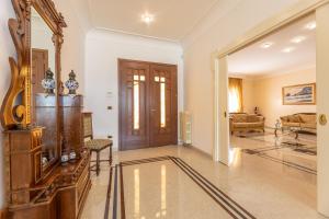 a living room with a mirror and a couch at Villa Oasi di Pace in Nardò