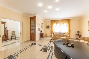a large living room with a couch and a table at Villa Oasi di Pace in Nardò +48 photos