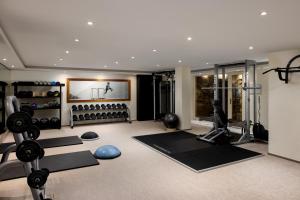 a fitness room with a gym with exercise equipment at Mandarin Oriental, Prague in Prague