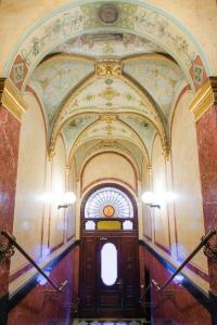 an ornate building with a door and a window at Upper Room Hotel Kurfürstendamm in Berlin