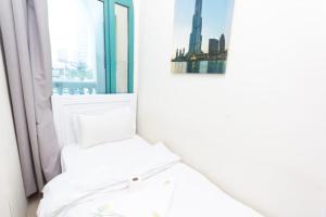 Ένα ή περισσότερα κρεβάτια σε δωμάτιο στο Crown rooms for Men