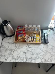 a table with a tray of snacks and drinks on it at BULUT GAYE Pansiyon in Edirne