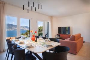 a dining room with a table and chairs at Villa aMA with Pool in Pai