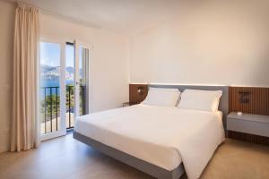 a bedroom with a large bed and a large window at Villa aMA with Pool in Pai +40 photos
