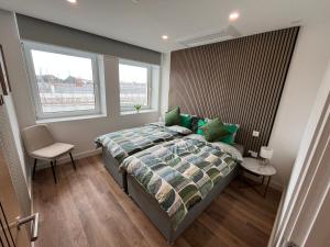 a bedroom with a bed and a window at Bournemouth Lookout in Bournemouth