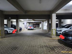a parking garage with cars parked in it at Platinum Place in Kikuyu