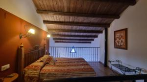Postel nebo postele na pokoji v ubytování Posada el Camino Almonaster
