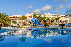a swimming pool at a resort with a slide at Moon Palace Nizuc - All Inclusive in Cancún