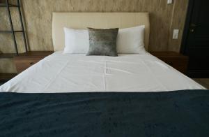 Postel nebo postele na pokoji v ubytování Hotel Saguramo Bliss