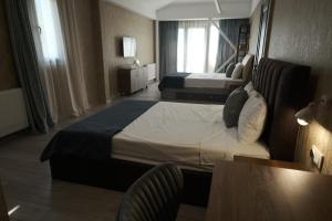 Postel nebo postele na pokoji v ubytování Hotel Saguramo Bliss