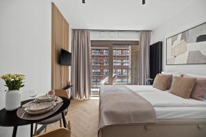 Ένα ή περισσότερα κρεβάτια σε δωμάτιο στο City Break Żurawie II